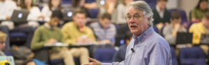 Economics professor Stephen Buckles teaches a class in a lecture hall