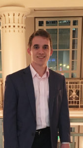 Photo of Jacob Vest standing in the mezzanine of a building