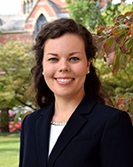 Michelle Marcus in front of trees and a brick building on the Vanderbilt University campus