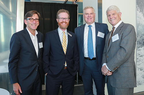 Jim Cuminale ‘78, Associate Dean Scotty Mann, David Gelfand ’87, (BA’84) and Frank Garrison ’79, (BA’76) at a NYC alumni reception held at Hudson Yards.