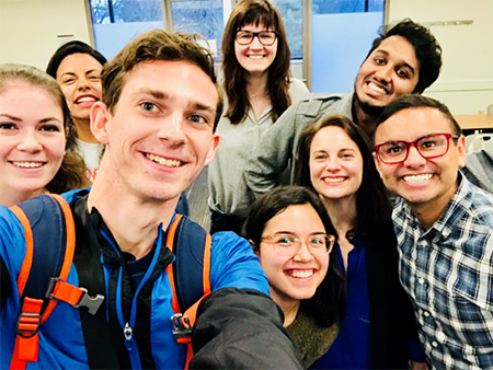 Caption: Pictured: Professors Tara McKay and Gilbert Gonzales pictured with undergraduate and graduate students currently enrolled in UNIV 3325/5325.