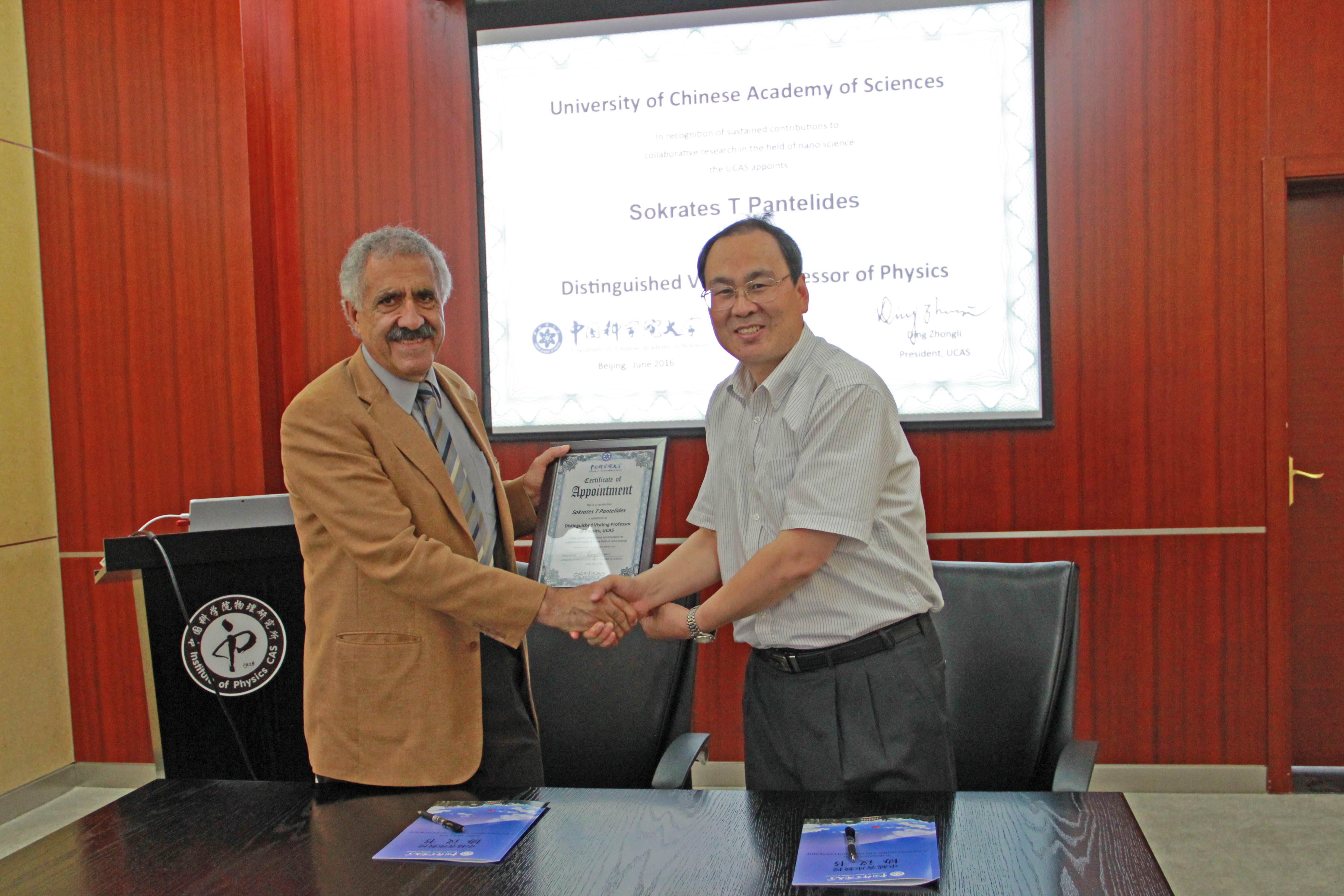 The University Vice President presenting the certificate of appointment.