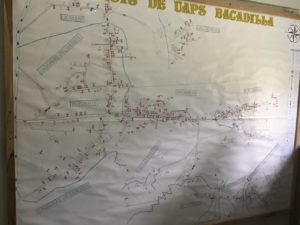 A map in the clinic with pins detailing medical conditions of residents in all 12 communities