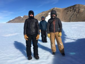 Marie Bergelin, Sarah Sturges, and Greg Balco prepare to board a helicopter on the Argosy Glacier, 2017.
