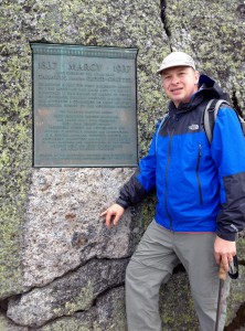 On top of Mt. Marcy, highest peak in NYS, in front of plaque dedicated to Geologist James Hutton
