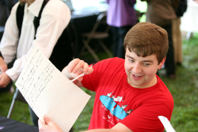 attendees at 2018 Bard's Birthday Bash enjoys writiing with a quill pen like Shakespeare did