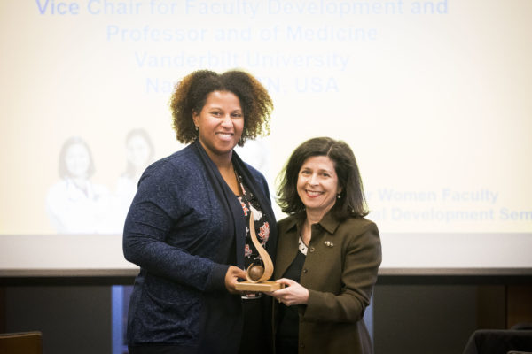 Women's Center Director Rory Dicker presents the Mentoring Award to Renã Robinson, associate professor of chemistry and Dorothy J. Wingfield Phillips Chancellor's Faculty Fellow. (Susan Urmy/Vanderbilt)