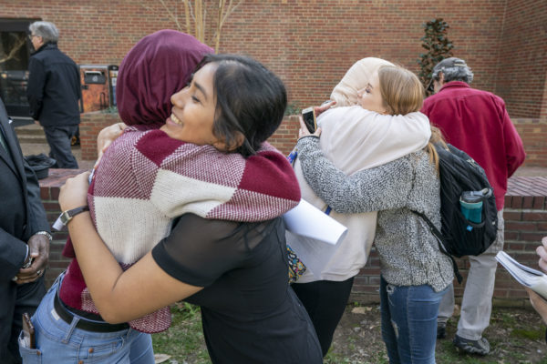 Students hug following the vigil on Monday afternoon.