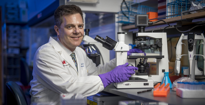 Dr. James Crowe in his lab