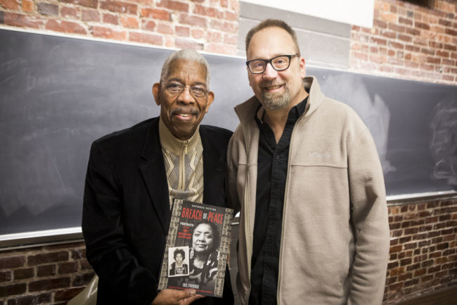 '60s Freedom Rider Rip Patton holds 'Breach of Peace' book in which Patton's mugshot is included. Standing next to him is author Eric Etheridge