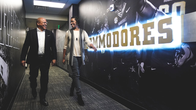 Vice Chancellor for Athletics and University Affairs and Athletics Director Malcolm Turner walks with Senior Associate Athletics Director Candice Lee at the McGugin Center on Feb. 1. (Vanderbilt University)