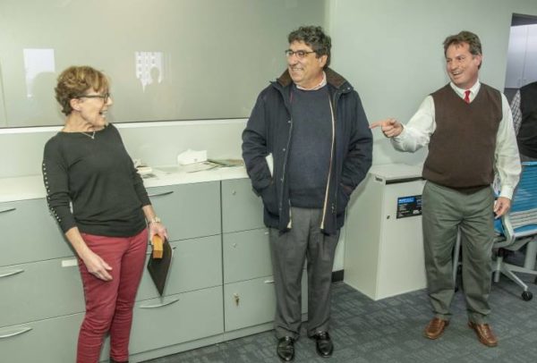 Linda Forceno with VIRG is completely surprised at holiday potluck when Chanceelor Nicholas S. Zeppos presnts her Heart and Soul staff award, with VIRG Interim Director Richard Iannelli , who nominated her, looking onlooking on