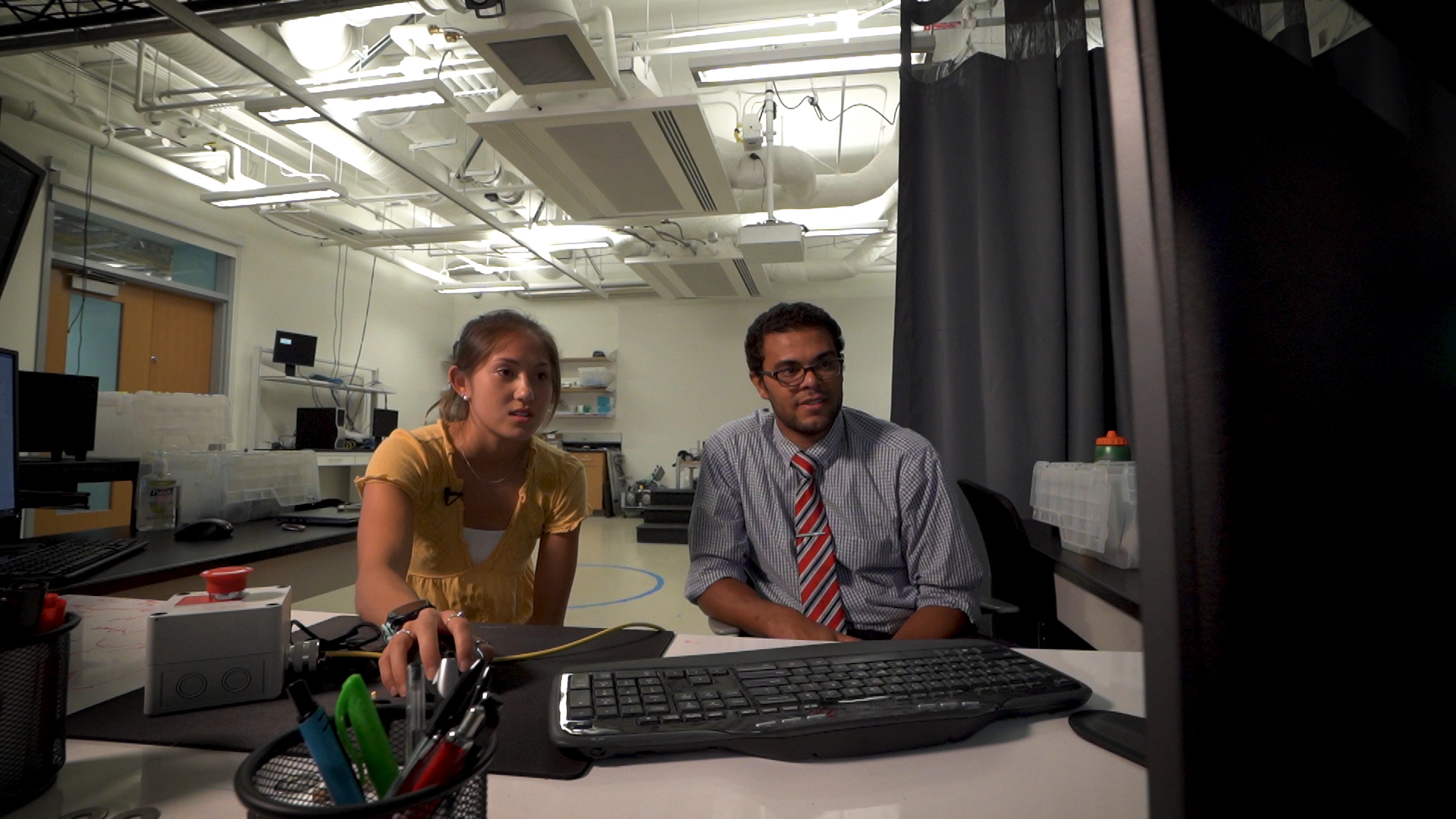 Sara Tsai and Karl Zelik research in his lab