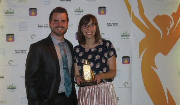 Zac Dupwe and Ashley Majewski accept the university's awards.