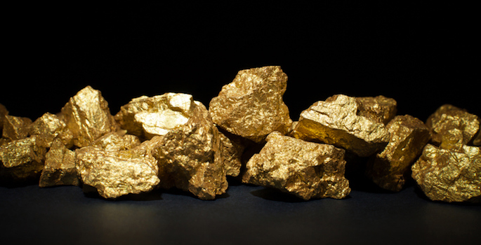 mound of gold close-up on black background