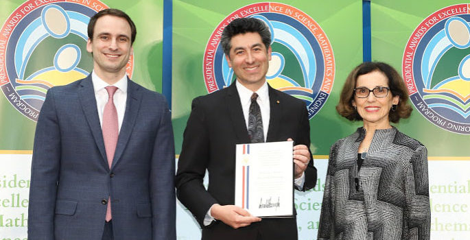 Stassun (center) with NSF Director France Cordova and White House official. photo courtesy of the National Science Foundation