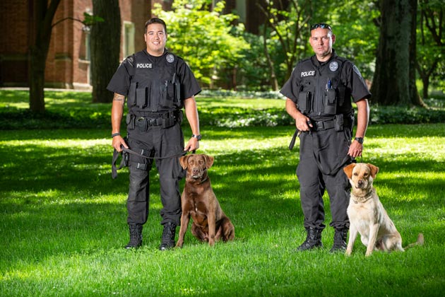 Brutus and handler Sgt. John Oliver (left) and Dyno and handler Lt. Jason Bates (right). (Joe Howell/Vanderbilt)