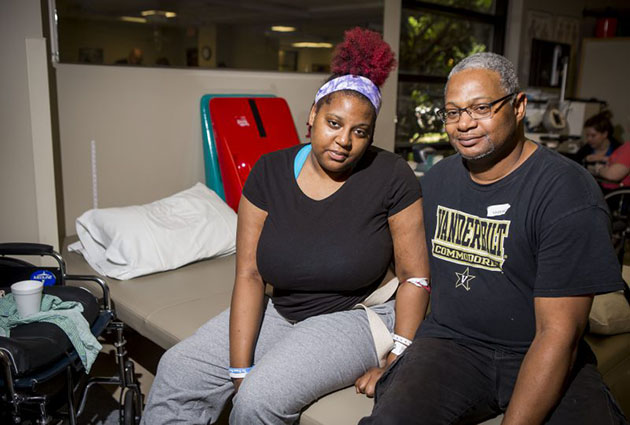 Shantia “Tia” Waggoner and her father Ray at Vanderbilt Stallworth Rehabilitation Hospital in late May. About a month earlier, she was one of those injured in a mass shooting at the Antioch Waffle House, which killed four people, including Tia’s fiancé. Photo by Susan Urmy.