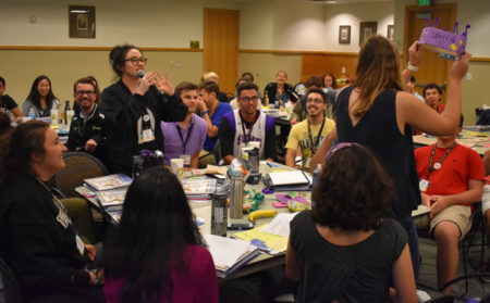 Kelly Perry (with microphone) participates in a VUcept training session.