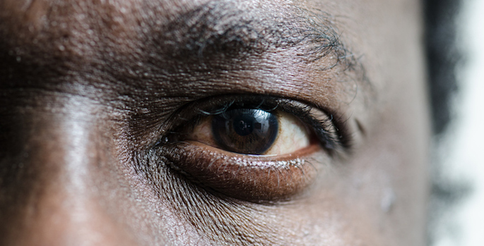 Close up on the left eye of a black man