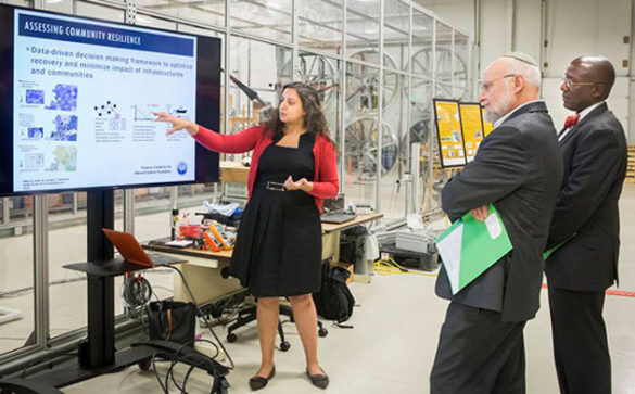 Assistant Professor of Civil and Environmental Engineering Hiba Baroud discusses her research with Alexander Kott and Jaret Riddick of the Army Research Lab. (Vanderbilt University)