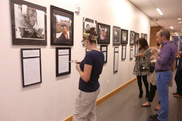 Students view photos and text as part of the Resilient Souls Project exhibition at Warren and Moore Colleges. (Anne Rayner/Vanderbilt)