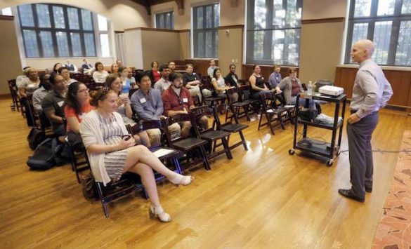 Wallace speaking to an audience of about 50 diverse postdoctoral scholars at Alumni Hall