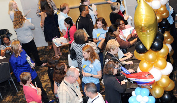 The airport-themed Flight School Learning Fair featured 12 “gates” where the 800 participants could speak with 75 subject-matter experts about how specific changes will impact them. (Vanderbilt University)