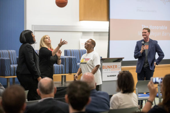 Mayor Megan Barry facilitates a jump ball with Music City Icons founder Renee Bobb (left) at the Muster Across America launch May 24 at the Wond'ry. (John Russell/Vanderbilt)