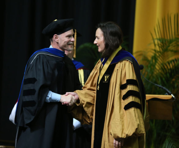 Graduate School Dean Mark Wallace and Founder's Medalist Emily Hennessy. (Joe Howell/Vanderbilt)