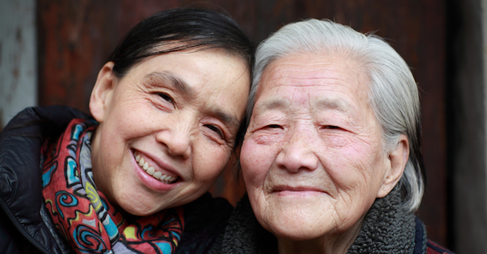 elderly Asian mother and adult daughter