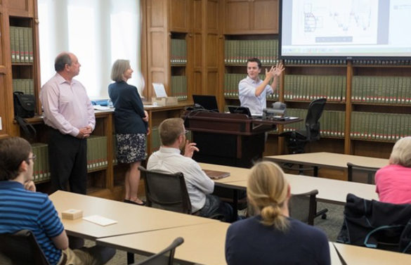 L-r: David Blum, one of the founders of the "Wild Bunch," and University Librarian Valerie Hotchkiss listen to a presentation by Peabody doctoral student Ben Shapiro on "Interaction Geography." (Jon Erickson/Vanderbilt)