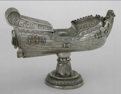 A navicula, a silver incense boat modeled after the oceangoing ships that brought early explorers to new lands.