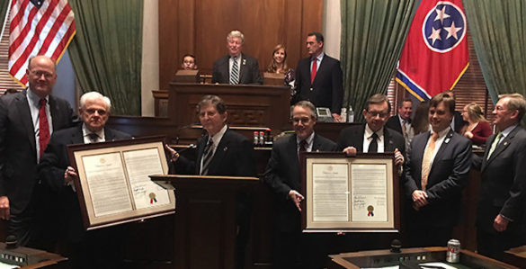 legislators holding up proclamations in chambers