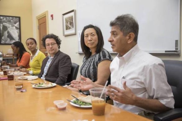 photo of folks chatting over lunch