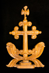 ornate gold cross on black background