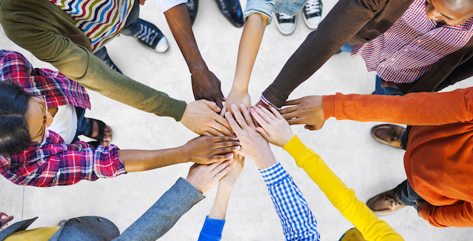 diverse hands together teamwork diversity