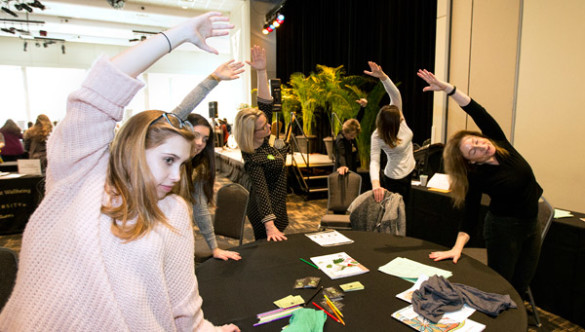 Desk yoga demonstration at the GO THERE campaign kickoff Jan. 27. (Joe Howell/Vanderbilt)