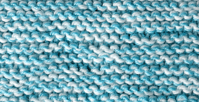 Close-up of a woolen knitted texture (blue)