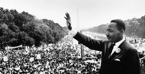 King on podium overlooking the enormous crowd