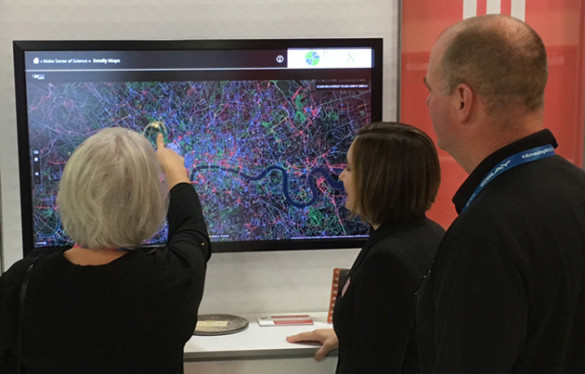 Visitors to the "Places and Spaces" exhibition are invited to touch the data and engage with the macroscopes at a touchscreen kiosk. (image courtesy of Places and Spaces: Mapping Science)