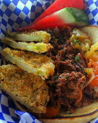 A food truck favorite, 14-hour braised beef brisket served on lightly grilled nan bread with fried green tomatoes and tomato chutney. (Vanderbilt University)
