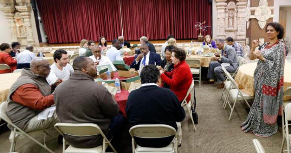 Radha Reddy, a founding board member of the Hindu temple, explained its history while the group enjoyed lunch as part of the Nov. 5 Chancellor Charter interfaith tour. (Steve Green/Vanderbilt)