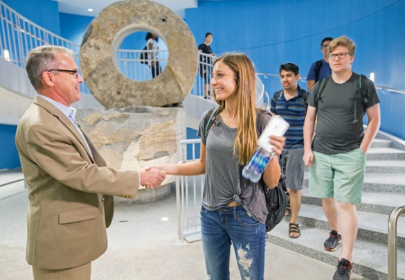 School of Engineering Dean Philippe Fauchet greets students on the first day of classes at the new Engineering and Science Building Aug. 24. (John Russell/Vanderbilt)