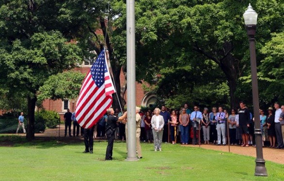 Provost and Vice Chancellor for Academic Affairs Susan R. Wente and members of the Vanderbilt community gathered on Alumni Lawn July 8 to lower the American flag in honor of police officers killed in Dallas, Texas, July 7. (Steve Green/Vanderbilt)