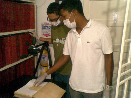 Two students work on digitizing slave records in Colombia. (Vanderbilt/ESSSS)