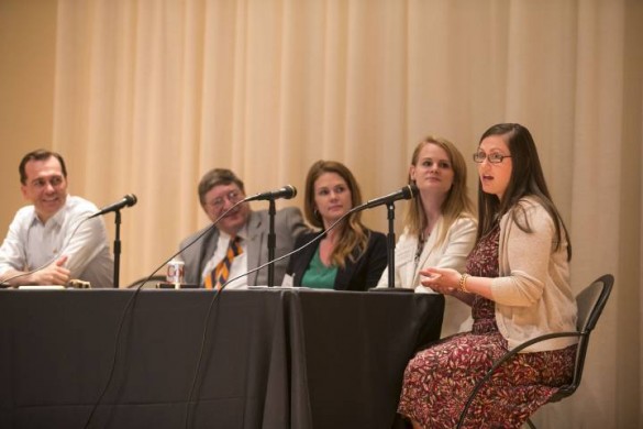 participants seated on stage behind a table