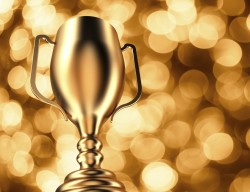 Gold Trophy on Gold Bokeh Background