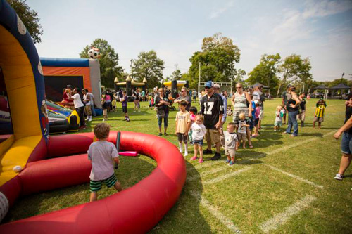 Young Commodore fans enjoyed inflatables and other games at the 2015 football tailgate.