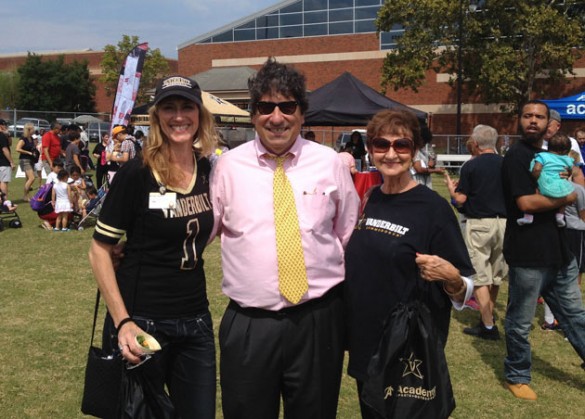 L-r: Children's Hospital employee Brooke Austin, Chancellor Nicholas S. Zeppos and Austin's mother at the 2015 football tailgate. 